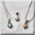 J04. Sterling silver and opal pendants. 